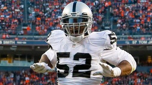 Oakland Raiders defensive end Khalil Mack (52) dances in the...