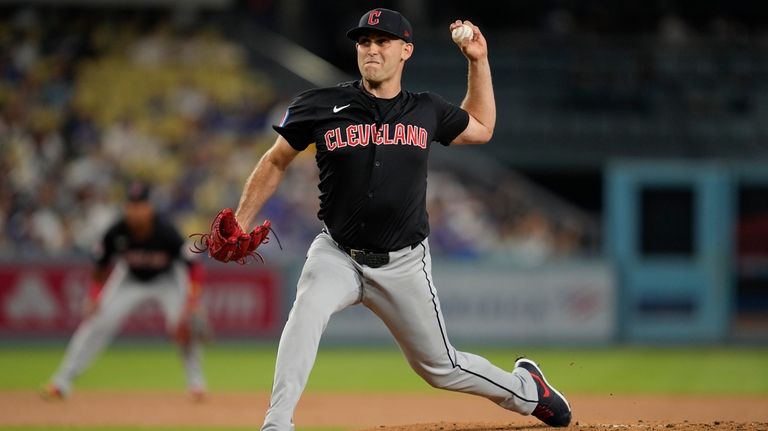 Cleveland Guardians starting pitcher Matthew Boyd throws during the first...