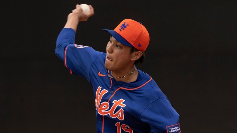 Mets pitcher Shintaro Fujinami throws during a spring training workout...