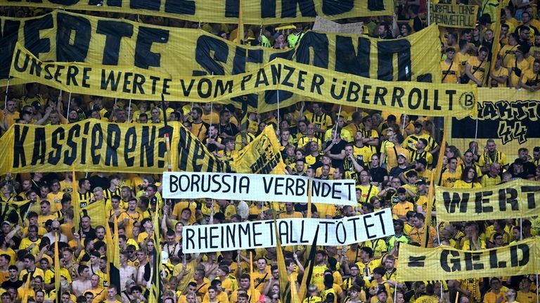 A banner against Borussia Dortmund's sponsorship deal with German arms...