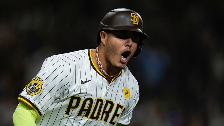 San Diego Padres' Manny Machado celebrates after hitting a two-run...