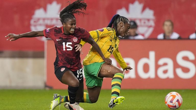 Canada's Nichelle Prince (15) battles Jamaica's Tiffany Cameron for the...