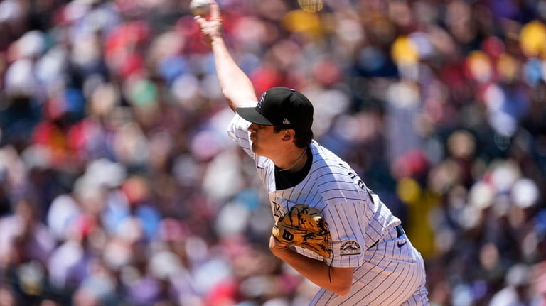 Colorado Rockies starting pitcher Cal Quantrill works against the Philadelphia...