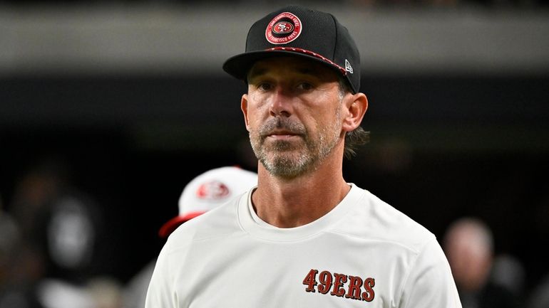 San Francisco 49ers head coach Kyle Shanahan stands on the...