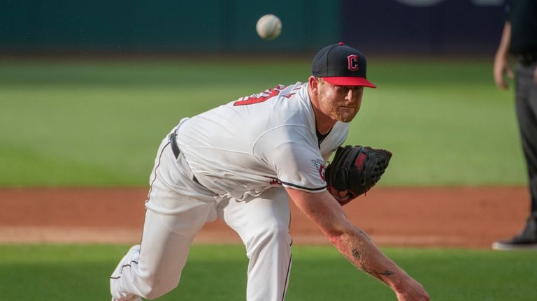 Cleveland Guardians starting pitcher Ben Lively delivers against the Baltimore...