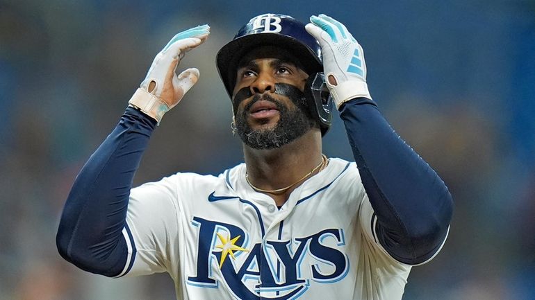 Tampa Bay Rays' Yandy Diaz celebrates after his two-run home...