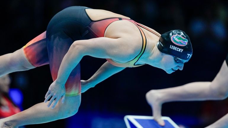 Katie Ledecky swims during a Women's 800 freestyle preliminary heat,...