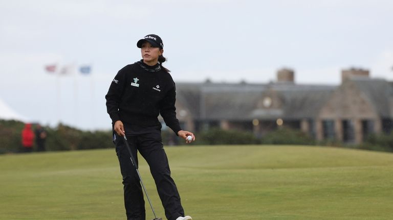 Lydia Ko, of New Zealand, reacts to the crowd after...