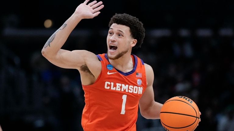 Clemson guard Chase Hunter (1) dribbles during the first half...