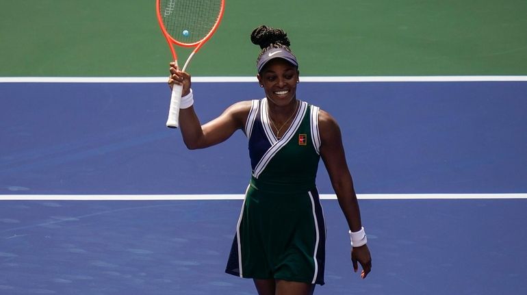 Sloane Stephens, of the United States, waves to the crowd...