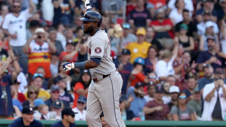 Houston Astros' Yordan Alvarez celebrates after his home run in...