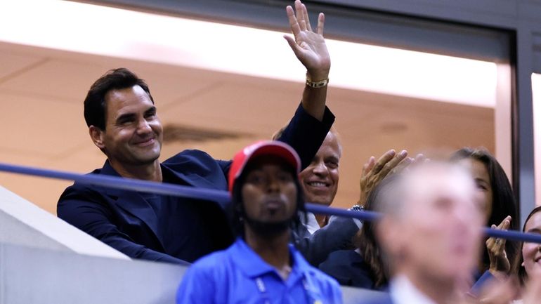 Tennis great Roger Federer waves to the crowd during the...