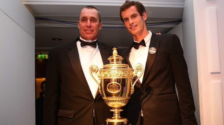 Gentlemen's Singles Champion Andy Murray of Great Britain, right, poses...