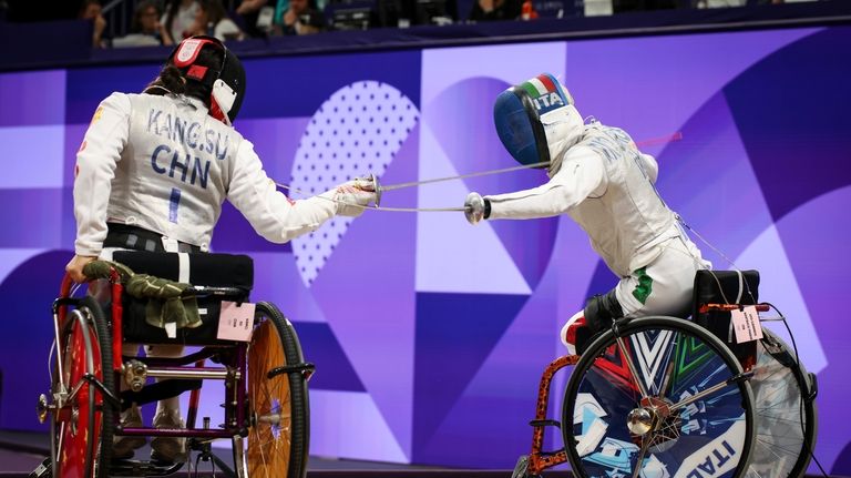 Italy's Beatrice Maria Vio Grandis, right, competes against China's Su...