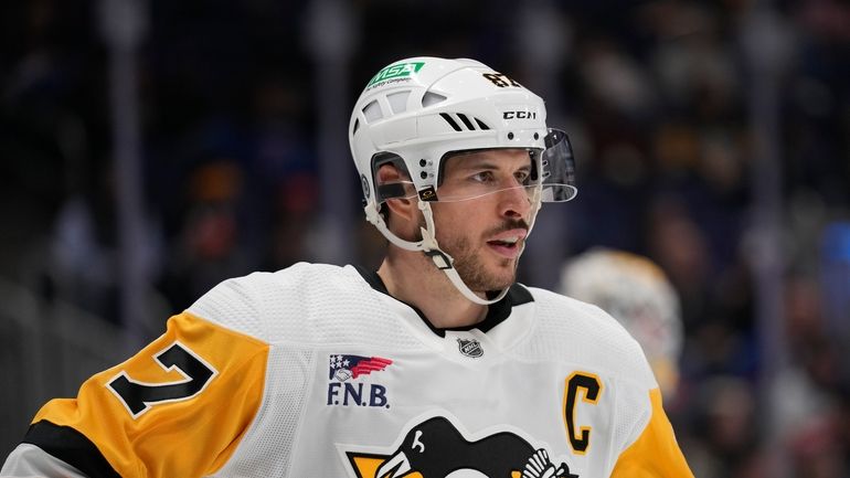 Pittsburgh Penguins' Sidney Crosby looks on during the second period...