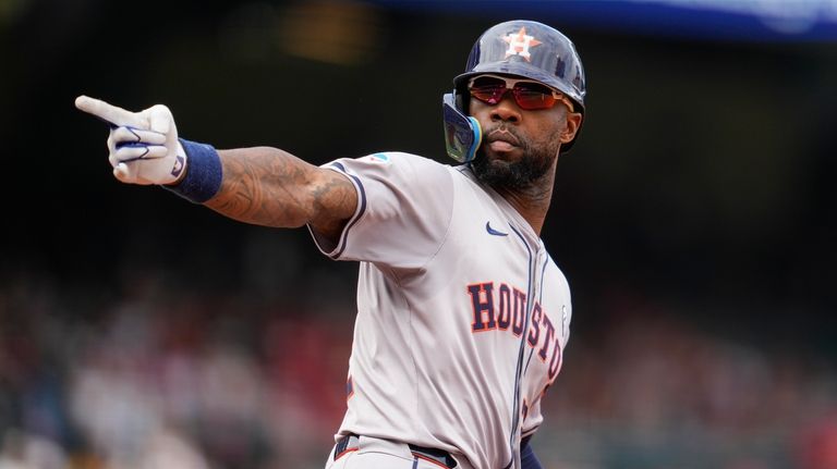 Houston Astros' Jason Heyward celebrates after hitting a home run...