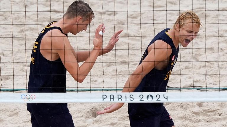 Sweden's Jonatan Hellvig, left, celebrates with teammate David Ahmad during...