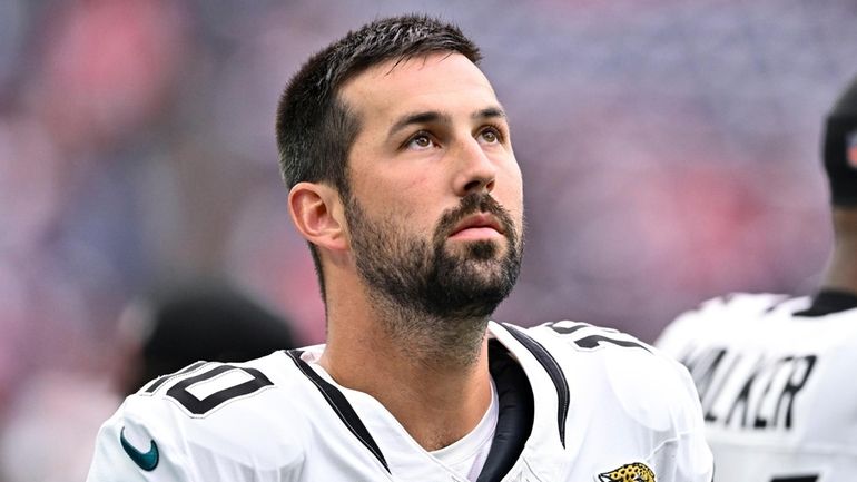 Jacksonville Jaguars placekicker Brandon McManus stands on the sideline during...