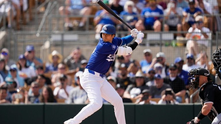 Los Angeles Dodgers designated hitter Shohei Ohtani prepares to bat...