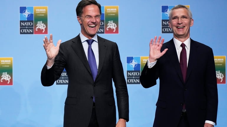 NATO Secretary General Jens Stoltenberg, right, greets Netherland's Prime Minister...