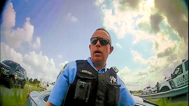 This still image from a deputy's body camera video provided...