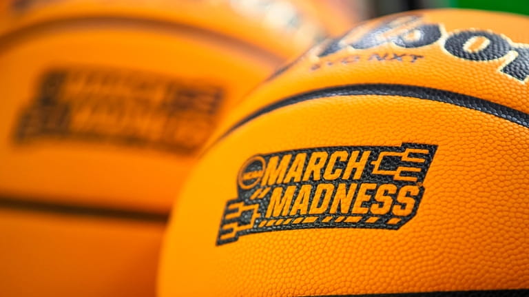 March Madness branding is displayed a Wilson EVO NXT basketball...