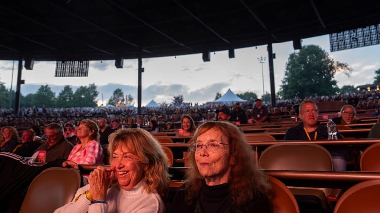 Beverly "Cookie" Grant, left, and Ellen Shelburne watch George Thorogood...