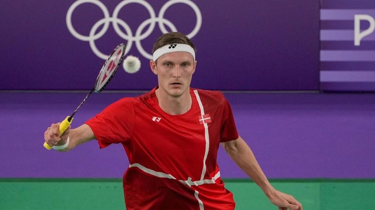 Denmark's Viktor Axelsen plays against Thailand's Kunlavut Vitidsarn during their...