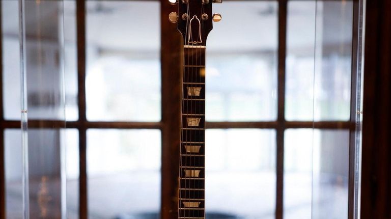 A Les Paul Standard guitar owned by Keith Richards of...