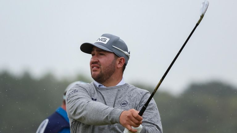 Thriston Lawrence of South Africa hits off the 14th tee...