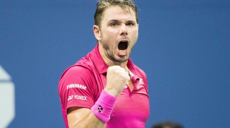 Stan Wawrinka pumps his fist after winning the second set...