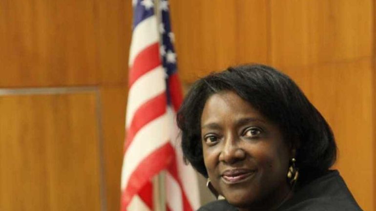 Judge Michele Woodard, of Westbury, stands in her courtroom in...