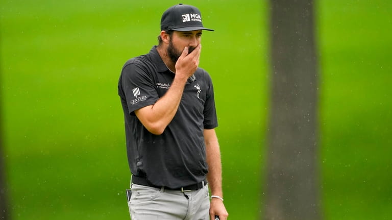 Mark Hubbard reacts after missing a putt on the 16th...
