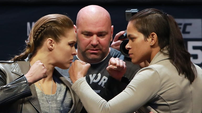 UFC Women's Bantamweight Champion Amanda Nunes faces off with Ronda...