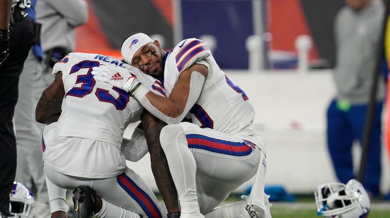 Buffalo Bills' Siran Neal (33) and Nyheim Hines react after...