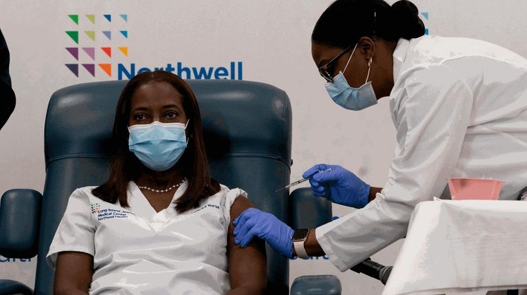 Sandra Lindsay, left, a nurse at Long Island Jewish Medical Center,...