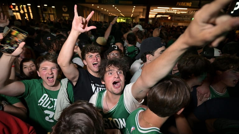 Boston Celtics fans react following the Celtics victory over the...