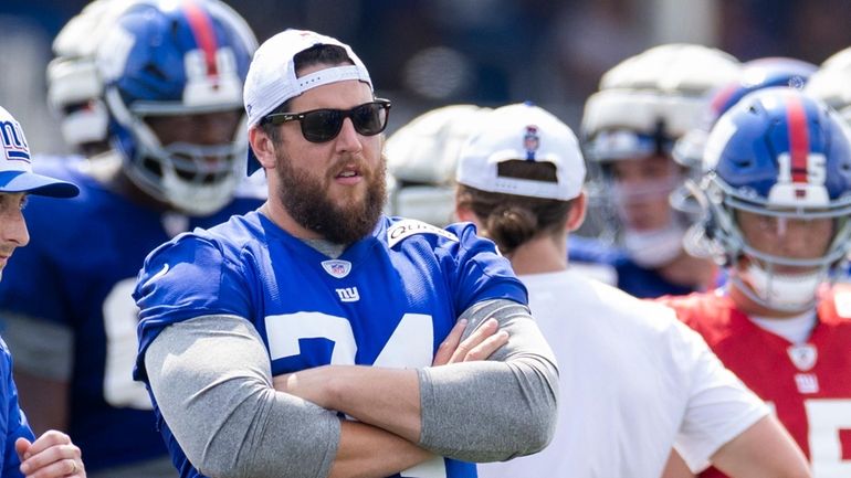 Giants' Greg Van Roten looks on during training camp at...