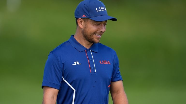 Xander Schauffele, of the United States, walks on the 10th...