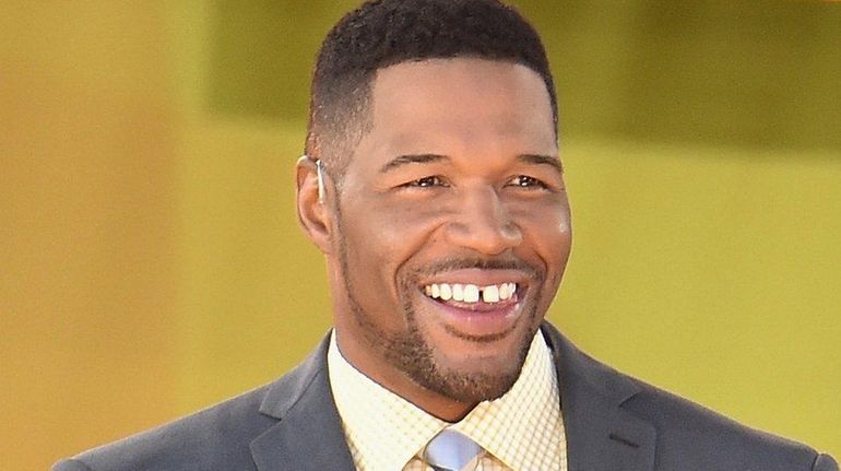 Michael Strahan talks to People magazine about his departure from...