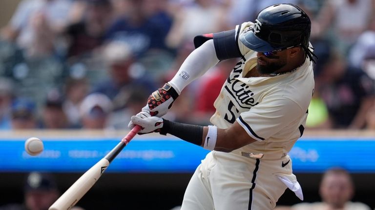 Minnesota Twins' Willi Castro hits a solo home run during...