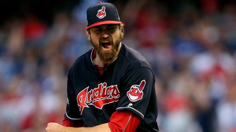 Andrew Miller of the Cleveland Indians celebrates after striking out...