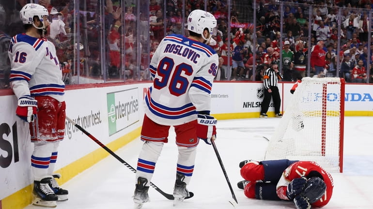 Evan Rodrigues of the Florida Panthers lays on the ground...