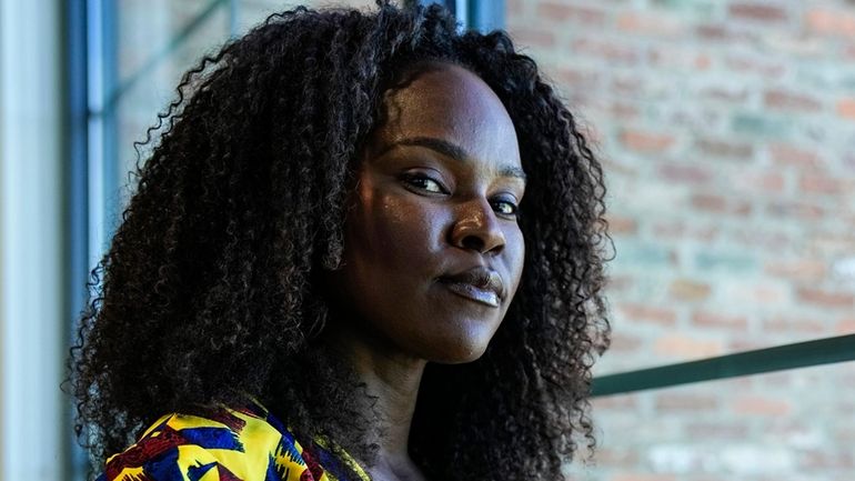 Sophia Danner-Okotie poses for a portrait in her shared workspace...