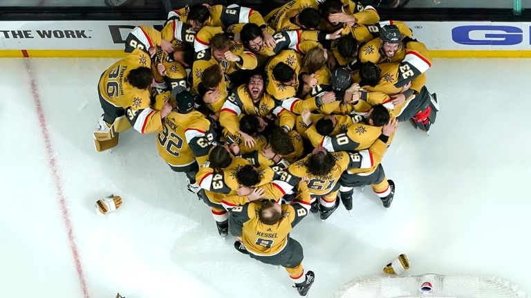 Members of the Vegas Golden Knights celebrate after they defeated...