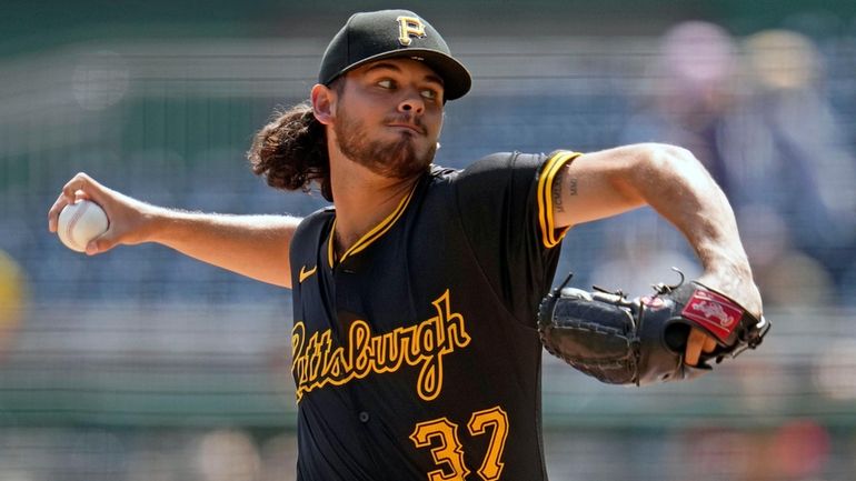 Pittsburgh Pirates starting pitcher Jared Jones delivers during the second...