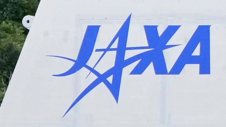 The logo of the Japan Aerospace Exploration Agency, or JAXA,...