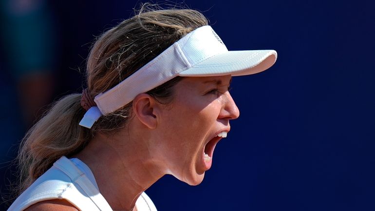 Danielle Collins of the United States reacts after scoring a...