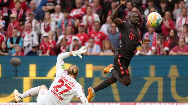 Bayern's Sadio Mane, right, scores a goal that was disallowed...