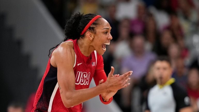 A'ja Wilson (9), of the United States, celebrates in a...